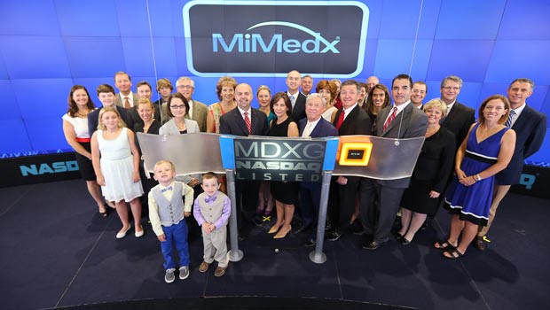 MiMedx management team on floor of NASDAQ stock exchange